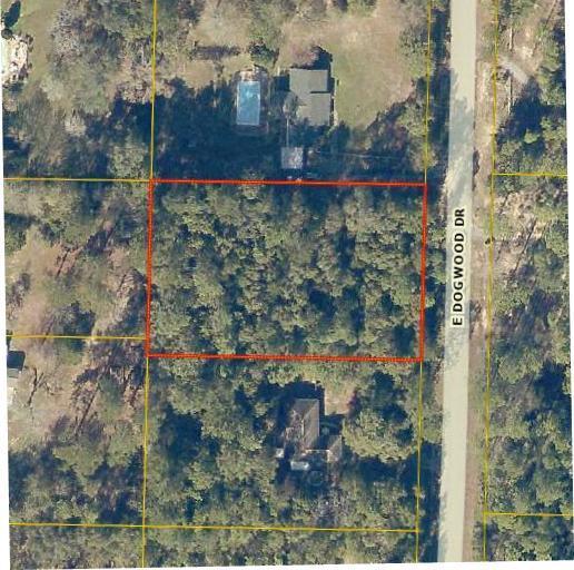 Beautifully wooded acre lot on Dogwood Drive East just minutes from shopping and schools. If you want privacy, you can keep the lot wooded and clear the minimum for your new home -or- partially clear the lot and design your own new landscape. Water and electricity are available on Dogwood Drive. Take a look at this affordably priced acre for your new home. Property is zoned Rural Residential. Located outside the city limits so no city property taxes!