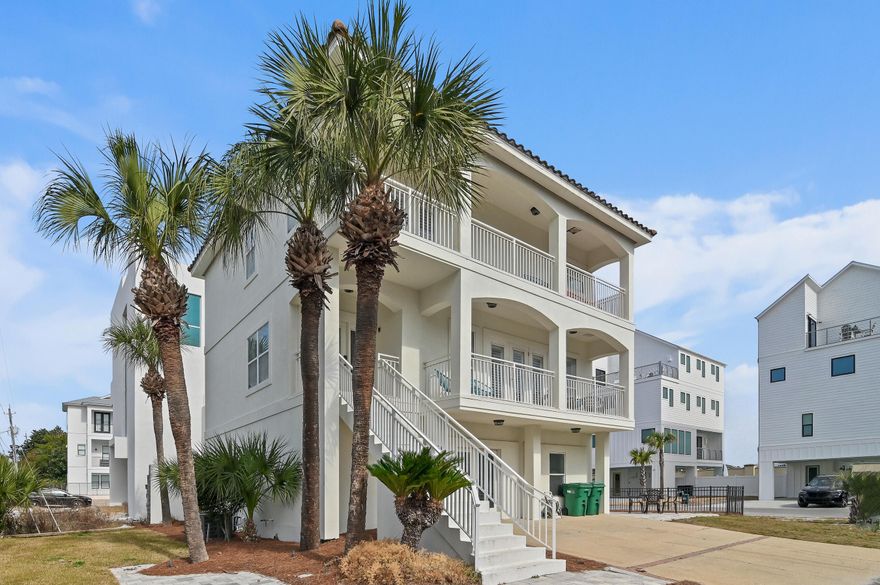 Looking for the perfect rental investment or personal beach retreat? This is it! Steps from the beach with no HOA, this spacious coastal home sits on a prime corner lot with generous outdoor living space--ideal for sunbathing, grilling, and even adding a pool. The ground floor features a game room, built-in bunks for six, plus king and queen suites with private baths. The second floor boasts an open-concept living area, dining space, and another king suite. The third-floor primary suite offers a fireplace, bunks, spa-like bath, plus an additional queen suite and loft area. Walk to dining, shopping, and more! Located just 100 yards from beach access, this home is close to things like Surf Hut, Silver Sands Outlets, Sandestin Resort, Destin Commons, 30A No busy streets, just a short walk to the sand! Whether you're looking for a high-performing rental property or a personal beach escape, this home delivers the best of both. Schedule your showing today!