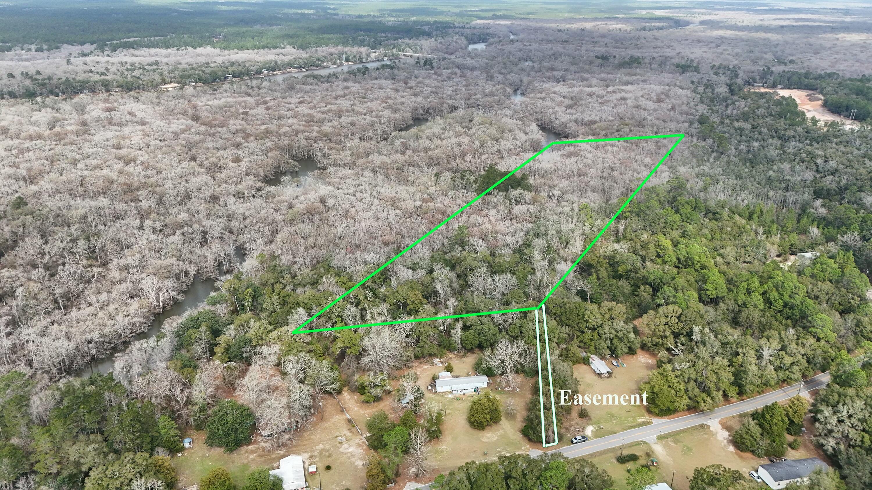 Sellers are accepting OFFERS!!! Come check out this 7.5 ACRE WATERFRONT parcel of land in Ebro, FL. New Survey Available. Property has a newly recorded 22ft Access Easement. Located just North of some of the World's Most Beautiful Beaches. Just minutes away from Ebro's Poker Room, Dollar General, Subway, public boat launches, state park, gas station, and Ebro community center. Perfect for your hunting or fishing getaway. There was an old trailer and may still be a septic tank and water well but sellers aren't for sure; and doesn't know the condition if they are on property. Call your favorite Realtor today and make this parcel yours!