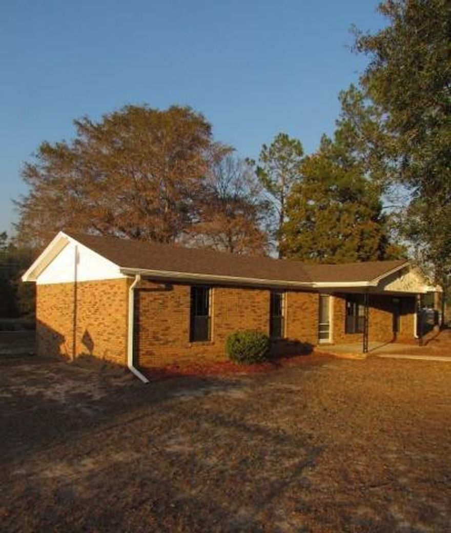 Don't let the age fool you, this home is cute as a button and ready for new owners! This neat all-brick home on a corner lot has been totally refreshed inside and out with new carpets, new neutral-toned paint, and a new dishwasher. Large mature trees dotted around the lot provide plenty of shade in the warmer months. This home offers a single-car garage around back as well as a fenced backyard (perfect for pets) and a nice-sized covered front porch. The wrap-around kitchen with breakfast bar provides plenty of cabinets and counter space. The dining area and living room are open to each other. Conveniently located in town, this home is less than a mile from Northwood Elementary and Pic-n-Sav and about a mile from CVS. Schedule your showing today!