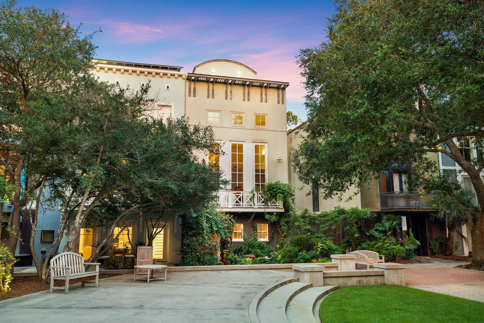 Nestled in the heart of Seaside, this unique Ruskin Place residence overlooks the town center and showcases stunning views of the famed emerald waters of the Gulf of Mexico. Designed by renowned architect Alexander Gorlin, this iconic residence truly characterizes quintessential Seaside. The exterior classical design was based on a tripartite Italian palazzo scheme and exhibits a modernist emphasis on flat, planar surfaces and simplified forms, with an industrial-type interpretation of a cornice in galvanized steel. The interior space is modern and features a double-height living area behind the three twelve-foot-high French doors set providing views into Ruskin Park.  An open staircase winds around a central pier uniting the ground floor with the rooftop office.  This processional