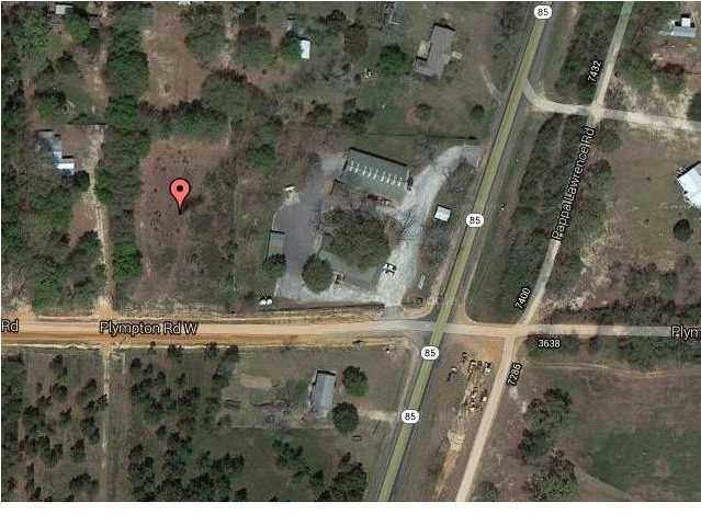 This is a 1.17 acre lot with dimensions aprox 175 X 288. Survey on file. It is zoned commercial. Can build residential or mobile home. It is cleared, high and dry and ready to build. Road was just paved. seller is a FL Licensed realtor(R). Listing Broker/Salesperson has ownership interest in the property.