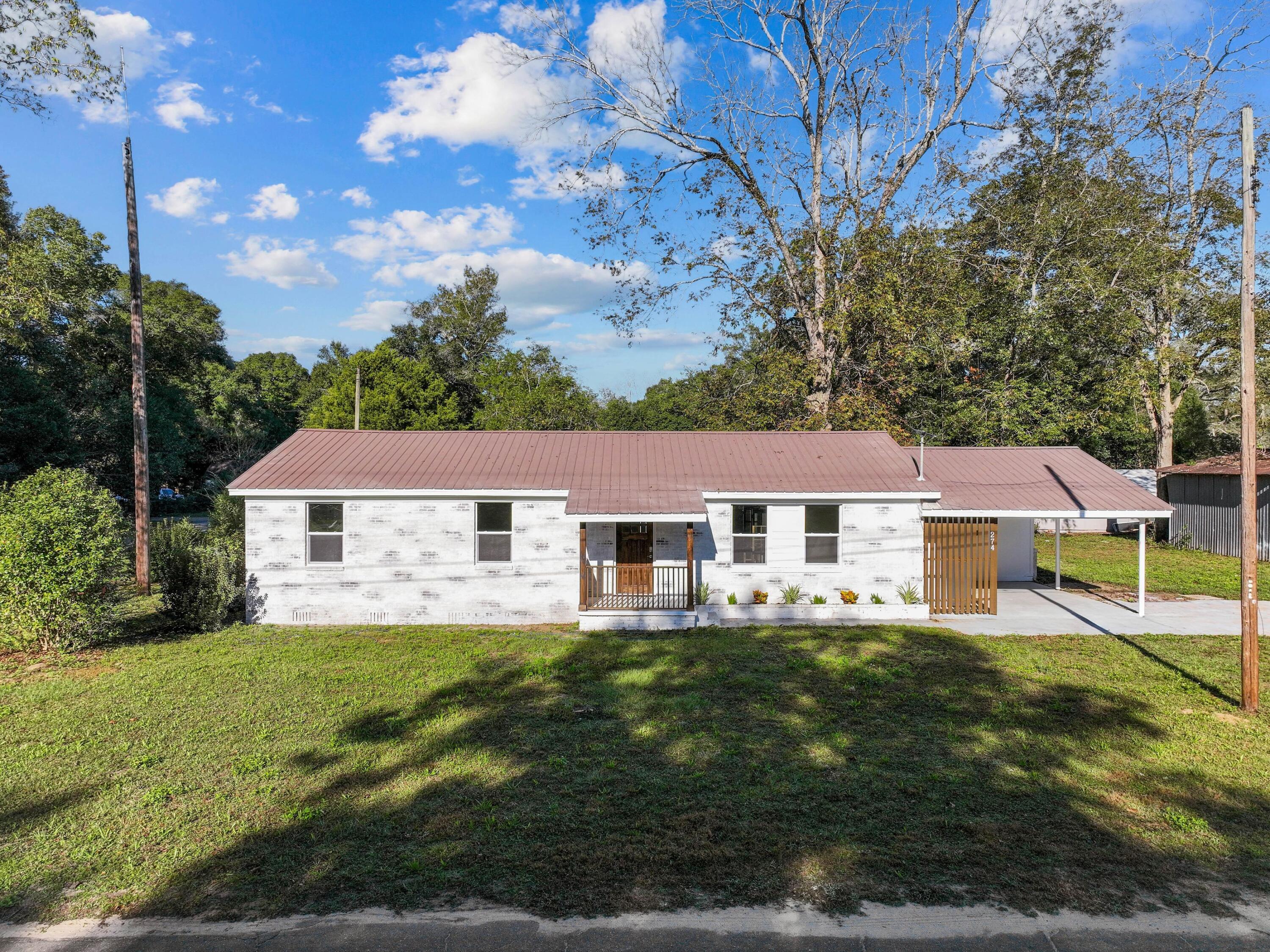 Discover an elegantly remodeled three-bedroom, two-bathroom brick home designed for convenience and charm, nestled in DeFuniak Springs. At 1,662 square feet, this home boasts a versatile bonus room, perfect for a home office or play area. Located on a prime corner lot, it offers a picturesque setting just moments away from the tranquil Lake DeFuniak and vibrant downtown. Ideal for first-time buyers or growing families, this property is strategically positioned for those seeking a balanced lifestyle. Enjoy easy access to local events by the lake, shop at the revitalized downtown boutiques or savor meals at nearby restaurants. Seasonal farmers' markets bring fresh produce and community spirit right to your doorstep. This residence is not just a home but a ticket to a lifestyle enriched with convenience and community. Whether you're drawn by the local culture or the allure of a spacious, freshly refurbished home, it all begins here.