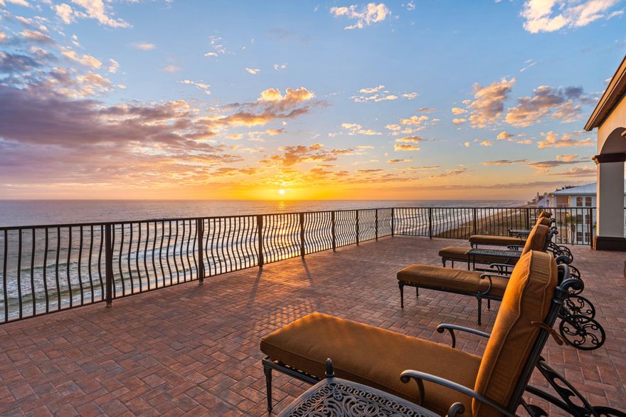 Perfectly positioned between the communities of Alys Beach and Rosemary Beach, this luxurious 6BR/6/2BA Mediterranean-style Gulf Front estate offers an extraordinary beachfront lifestyle within the prestigious, gated community of Santimo Beach, home to just 20 residences. Resting along the pristine sands of 30A's east end, this residence with over 8,000 square feet of living space, an elevator, private pool and spa, and two-car garage combines elegance and privacy with breathtaking Gulf vistas, delivering an ideal setting for those who seek refined living in a truly distinctive setting. Step inside to reveal lavish spaces with Old World charm highlighted by tiled floors, rich wood millwork and doors, plaster walls, custom Wood-Mode cabinetry, luxe tiled bathrooms, designer lighting and much more. The first level includes three spacious guest suites with ensuite bathrooms and a dune side covered porch with heated swimming pool and spa that can be remotely controlled.

On the second level, find the expansive living and dining spaces highlighted by stunning views from a light-filled wall of gulf front, oversized windows. This space features two separate seating areas, one with a cozy stone fireplace plus an elegant dining area flanked by a walk-in 468 bottle wine room. Delighting the most discerning of chefs, the gourmet kitchen offers an oversized breakfast bar, granite counters, a center island constructed of Venus leathered marble, and an extensive suite of commercial grade appliances from Perlick, Scottsman, Viking, and Sub-Zero. Step outside to a covered gulf front balcony spanning the width of the home with direct access to the private beach walkover, newly installed in 2023. The second level also includes a guest suite with ensuite bathroom and a powder room.

An elegant, custom curved staircase leads to the third level which houses the gulf front primary suite bathroom featuring a gas fireplace, sitting area, walk-in his and hers closets, a beverage center, direct access to the gulf front balcony, and a luxe ensuite with double sinks, whirlpool bathtub, and walk-in shower. An office with custom-built bookshelves and a guest suite with ensuite bathroom are also located on this level. 

Ascend to the fourth level and find the crown jewel with an amazing 2,000 SF of outdoor space for entertaining including a summer kitchen, oversized dining table and multiple sitting areas.  The top terrace includes both covered and open decks to enjoy the exceptional sunset and unobstructed beach views.  

With a host of recent upgrades, this exceptional estate embodies the best of sophisticated beachfront living on 30A. From the newly installed private beach walkover to the latest in smart home technology and premium finishes, every detail has been thoughtfully enhanced to elevate comfort and convenience. Whether enjoying sunsets from the beach or one of the expansive balconies, entertaining in the stunning outdoor spaces, or relaxing by the private pool and spa, this home offers an unparalleled retreat in one of the Gulf Coast's most sought-after communities.