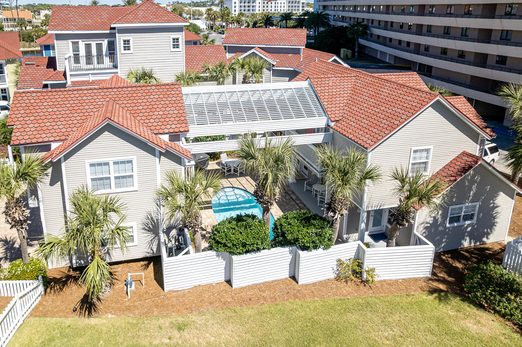 Three tiers back from a stretch of private beach in the gated gulf front community of Shipwatch.