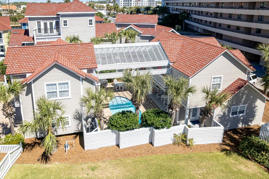 Three tiers back from a stretch of private beach in the gated gulf front community of Shipwatch.