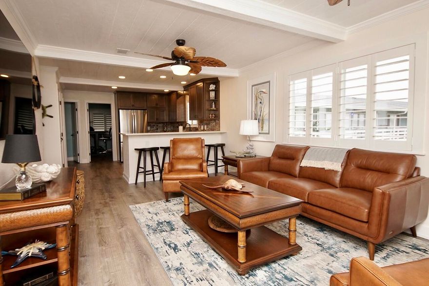 Beautifully, remodeled condo with an open floor plan, large windows in living area with spectacular waterfront views of Garnier Bay! This gorgeous condo was completely renovated from top to bottom in April 2021. If you desire beautiful views of Garnier Bay or easy access to Choctawhatchee Bay with a short boat ride to Crab Island, Harbor Walk and several restaurants, this is the perfect condo living. This unit has been completely updated which includes: Interior paint throughout, crown molding, deep baseboards and trim, recessed/can lighting in kitchen/bar, new upgraded ceiling fans, new vinyl plank floors, all upgraded interior doors, custom high-end plantation shutters for privacy, seamless glass shower door, new washer and dryer and much more! This 2nd floor unit has beautiful water views from the living room, kitchen, and master bedroom. A new roof was installed in 2022. An additional list of the condo renovations has been uploaded in the documents section. The unit is a 3 bedroom, 2 full bath unit. The third bedroom has a private entrance at the rear of the unit. Complex amenities include: One assigned parking space just steps away from the unit, waterfront pool, dock with boat slips (first come, first serve basis), and BBQ grills on premises. no short- term rentals are allowed in the condo complex.