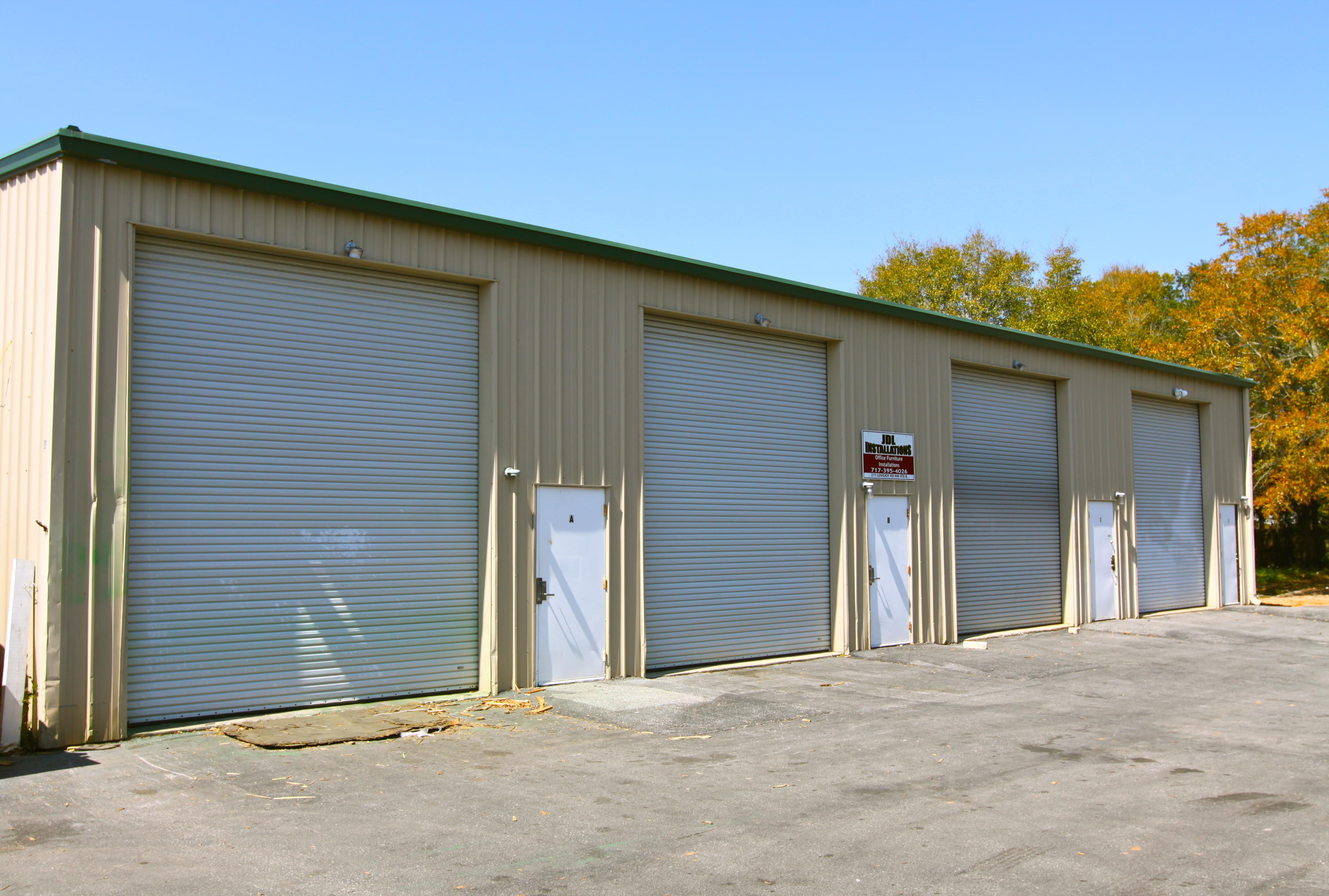 1000 sf warehouse with 200sf office directly across from the Dodge/ Jeep dealership.