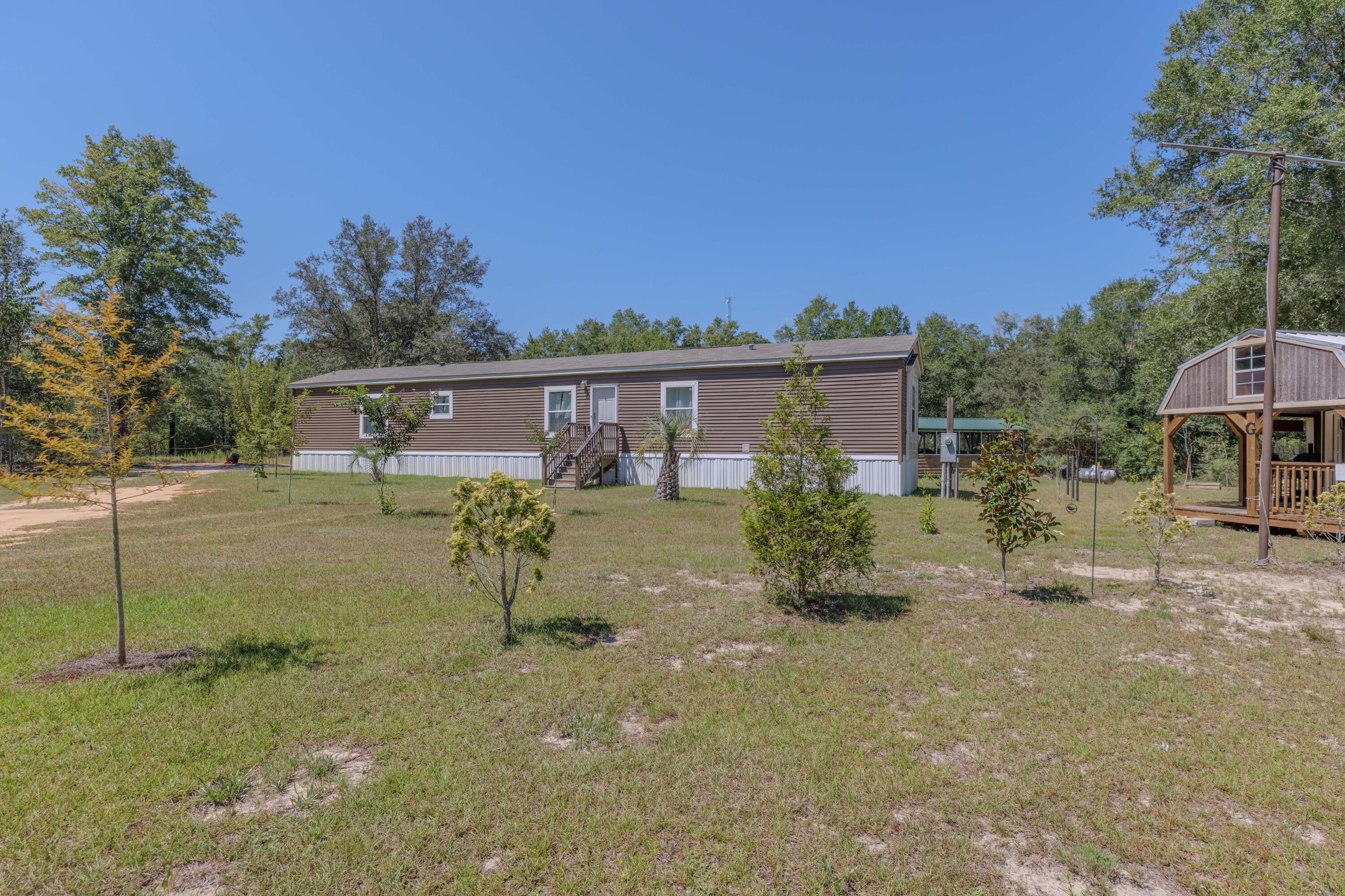Built in 2022, this three bedroom, two bath home sits on a vast 1.39 acre lot. So much room for activities! The 1,140 square foot open floor plan is efficient and bright. Systems are straightforward and reliable, including a gas water heater, well water, and a septic system serviced one month ago. No HOA. Flood insurance is not required. Short term rentals are allowed.