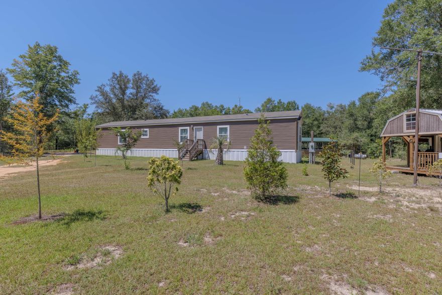 Built in 2022, this three bedroom, two bath home sits on a vast 1.39 acre lot. So much room for activities! The 1,140 square foot open floor plan is efficient and bright. Systems are straightforward and reliable, including a gas water heater, well water, and a septic system serviced one month ago. No HOA. Flood insurance is not required. Short term rentals are allowed.