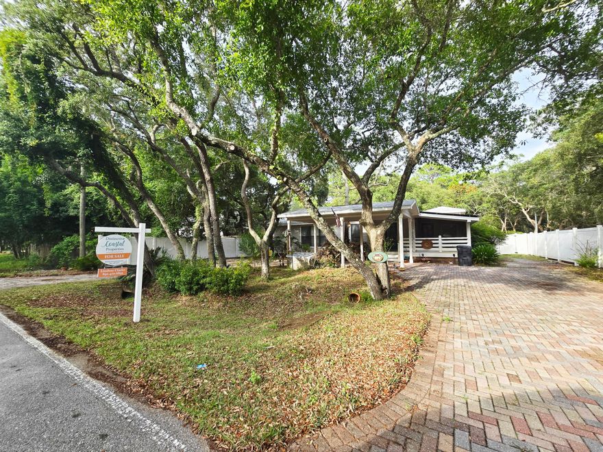 Charming Florida cottage nestled in private quiet lot close to the bay. Brand new deck and 8' vinyl privacy fence all the way around. This home features natural wood flooring with unique molding throughout. Custom kitchen has granite counter tops, stainless steel appliances, and tile flooring. Open floor plan allows for cozy living and dining area. The oversized master suite features walk-in closet, master bath with jetted tub, skylights allowing for lots of natural light and French doors to deck. Guest bedroom features private access to the deck. The third bedroom room features a Murphy-style bed, office desk area, and an abundance of built-in cabinets. Laundry room with front load washer and dryer, as well as secondary refrigerator. This home also includes solar paneling added in 2020.