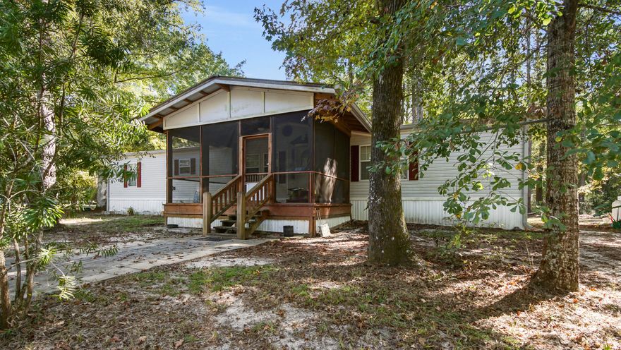 Fisherman's paradise! Huge manufactured home on close to an acre with 2 septics, wells , and power poles. Rent out RV spaces and spend the day on the river just a few minutes away. The community has a boat ramp with Choctawhatchee River access. Located only minutes from Freeport and the beaches of South Walton! This property is perfect for your weekend getaway, investment, or to raise a family. Make your appointment today! All information deemed reliable, verify if important.