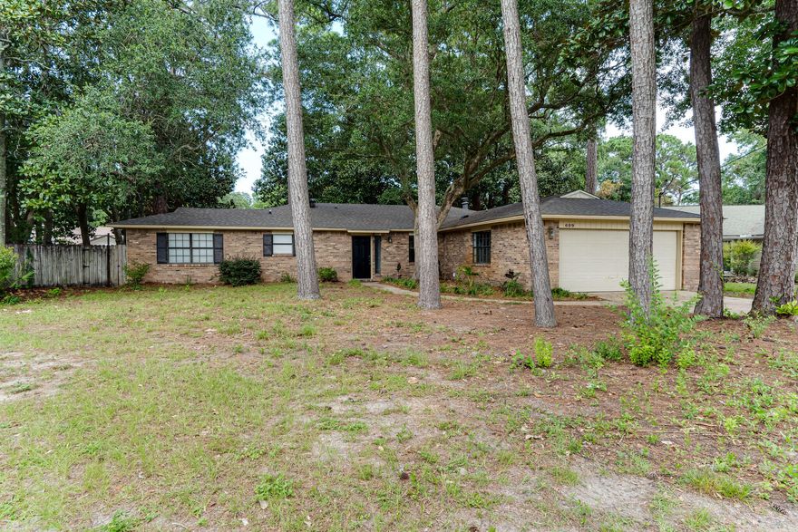 Welcome home!  Here you are just minutes away from Eglin Air Force Base as well as all the best shopping Niceville has to offer such as the new Publix Market, Panera Bread, Chick-fil-A, and much more.   This updated home is located in a quiet neighborhood on a cul-de-sac and is just a short walk to the neighborhood bayou park complete with boat launch. This partial brick home has beautiful mature oak trees and a huge fenced in backyard with a covered patio making it the perfect spot to relax and unwind after the stress of the day.  Once inside the home you will notice features such as a spacious living room with a wood-burning fireplace, and custom shelving in the dining room.  The kitchen includes stainless steel appliances, and is sure to please the chef in the family with lots of