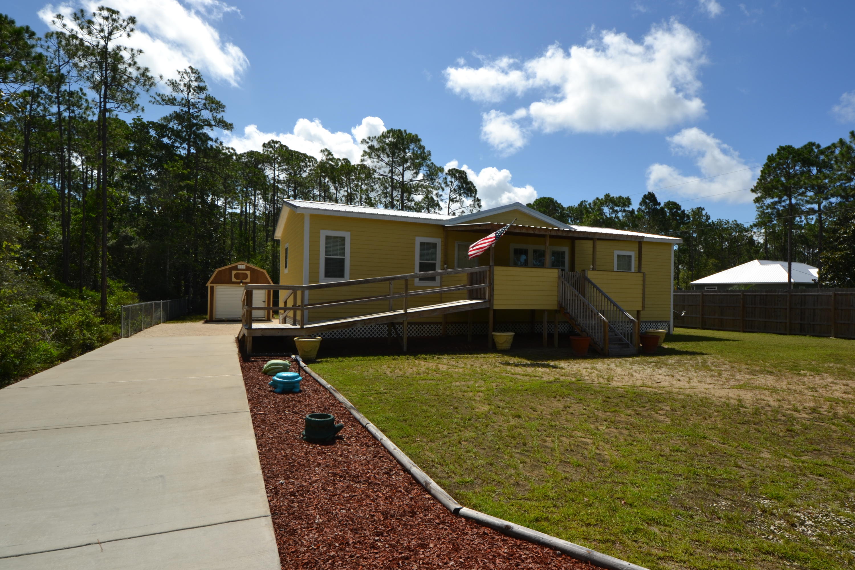 Affordable Home Sitting on 2 lots 50 x 125 each for 100 x 125 total and Just a short ride to Santa Rosa Beach & Destin. This 3 Bedroom, 2 Bath 1512 SF Home Features 2x6 Exterior Walls, -1/2 Drywall, Whole House Ventilation System, 9' Trey Ceilings, 5'' Baseboards, 4'' Crown Molding, Ceramic Backsplash, Upgraded Residential Cabinets, 72'' Roman Style Bath Tub, Ceramic Walk-in Shower in Master Bedroom, Large Corner Lot with Cross Fenced back Yard, Metal Roof, 10x20 Covered front Porch with Handicap Ramp, Nest Thermostat, Whirlpool Washer and Dryer with pedestal Storage, Stainless Frigidaire Kitchen Appliances and Breakfast Bar and a Huge 12x30' detached Garage. The Home has been meticulously Maintained and is in Excellent condition. Call your agent today to schedule a visit.