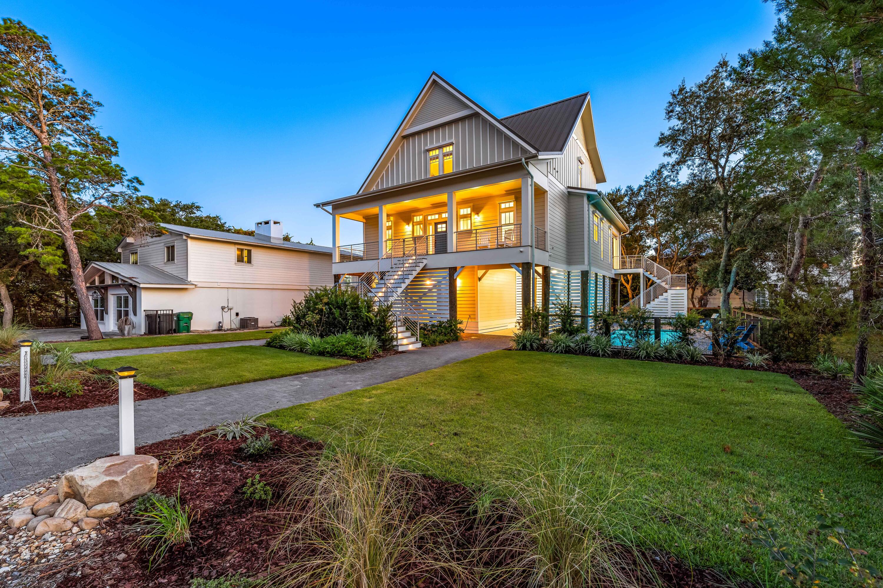 Indulge in the vibrant coastal lifestyle at 192 Betty Street - with panoramic views of the Gulf, Coastal Dune Lake and Draper Lake! This exquisite residence, constructed in 2020, seamlessly blends modern luxury with the laid-back charm of Blue Mountain Beach. Step into the heart of the home, where an open-concept main living area seamlessly integrates with the gourmet kitchen, boasting top-of-the-line Wolf, SubZero, and Cove stainless steel appliances. Whether you're entertaining guests or enjoying a quiet evening in, the coastal ambiance is ever-present. With outdoor living decks, pool and the standout feature - the rooftop deck, providing panoramic views of the Gulf of Mexico and the nearby Coastal Dune Lake, creating a perfect backdrop for social gatherings..