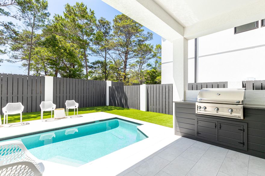Seller is offering a $200,000 gross rental income guarantee for the first 12-months post-closing. Rare new construction under $2M just off 30A. Seacroft Cottages is an exciting new 14 home subdivision conveniently tucked just off County Hwy 393 and a short stroll from all 30A has to offer including ultra-happening Shunk Gulley restaurant and 30A's widest public beach access at Ed Walline Park. No wonder this ''has it all'' home is projected to produce over $250K per year in vacation rental income. Your own private pool with hot tub and spillover water feature, grill and alfresco dining sits just off a private lounge with Marvel wine cooler for first floor convenience. A charming guest bedroom with private bath and bunk room with its own full bath offer quick outdoor access. One of two stackable Electrolux washer/dryer closets service the first floor. An expansive main living space well-positioned on the second floor with a deep balcony. Gather up around the chef's kitchen or spill on over to the comfy living area. This house says bring the crowd on in. The inviting gourmet kitchen for the chef in the group includes a high-end stainless steel Viking appliance suite with a six-burner gas stove, gorgeous marble countertops and bar seating for 4. A large pantry with built-in shelving adds extra storage. The adjacent dining area can accommodate a large table for gatherings. One of the two second-level bedrooms has a private bath. The third floor houses the primary suite with a private bath and balcony access with two additional bedrooms, both with a private bath. A large lounge area offers additional space for everyone. Located adjacent to Gulf Place entertainment district. Santa Rosa Golf club is a five-minute drive and offers some of the area's best semi-private play. Designer furnishings are negotiable.
