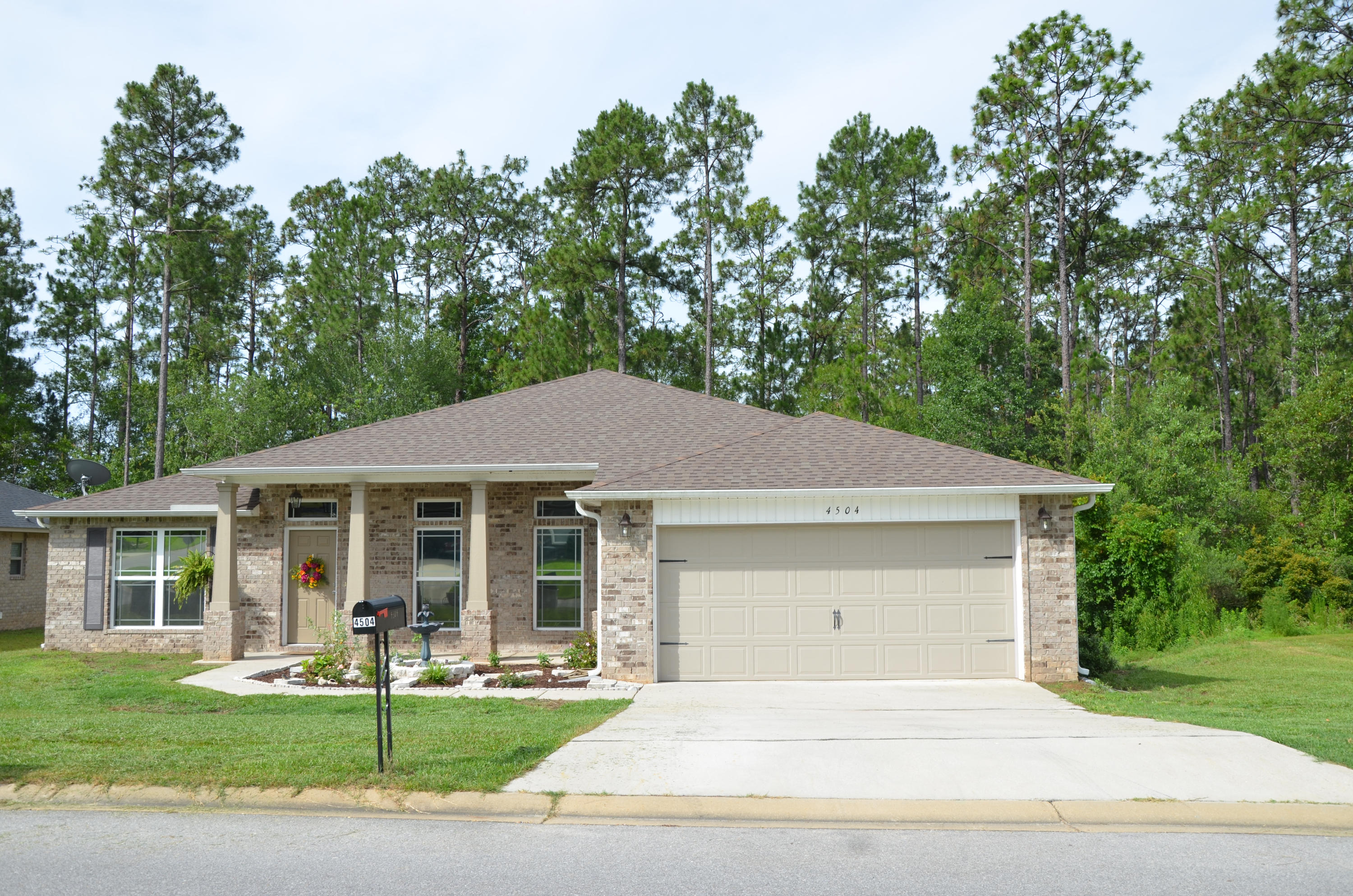 LOCATION, PRICE, AND SQUARE FOOTAGE! Sacrifice nothing with this spacious, high-end, nearly-new 4 bedroom/3 bathroom stunner. Find it nestled on an ultra-private lot backing to a designated green zone in ONE OF THE SOUTHERN MOST SUBDIVISIONS IN ALL OF CRESTVIEW! Get home sooner from Duke Field, 7th Group, Eglin or Hurlburt, AND get to the white sands of Destin faster! Office with french doors and formal dining room welcome you into the open floorplan featuring a jaw-dropping gourmet kitchen boasting thick GRANITE SLAB counters, huge island, STAINLESS STEEL appliances, built-in desk, & walk-in pantry! On one side of the family room are 3 generous bedrooms, 2 full baths (1 Jack-n-Jill style) & separate laundry. On the other side lies an enormous master retreat with en suite bathroom!