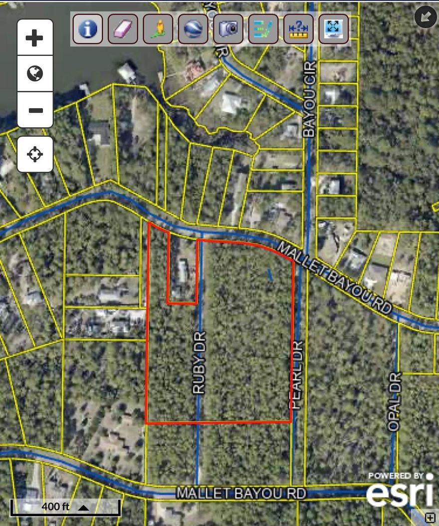Discover the potential of this mostly flat, wooded, and dry 6.904-acres, zoned Rural Village with the capacity for 2 units per acre.  Situated in a growing area of bayou front homes.Whether you're looking to develop a community or build a serene country escape, this property offers endless possibilities. Imagine creating an estate surrounded by nature, yet conveniently close to the vibrant heart of Freeport. Experience the charm of small-town living within an  easy drive to the stunning beaches of the Emerald Coast. Whether you envision a cozy retreat, a spacious family haven, or a new community, this lot provides the perfect canvas for your dreams.  *Buyer to confirm all details*