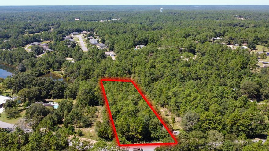 Nice 1.06 acre wooded lot lot that fronts Ridge Lake Road. Conveniently located to schools and north Crestview restaurants. Bring your house plans and build your dream home today.