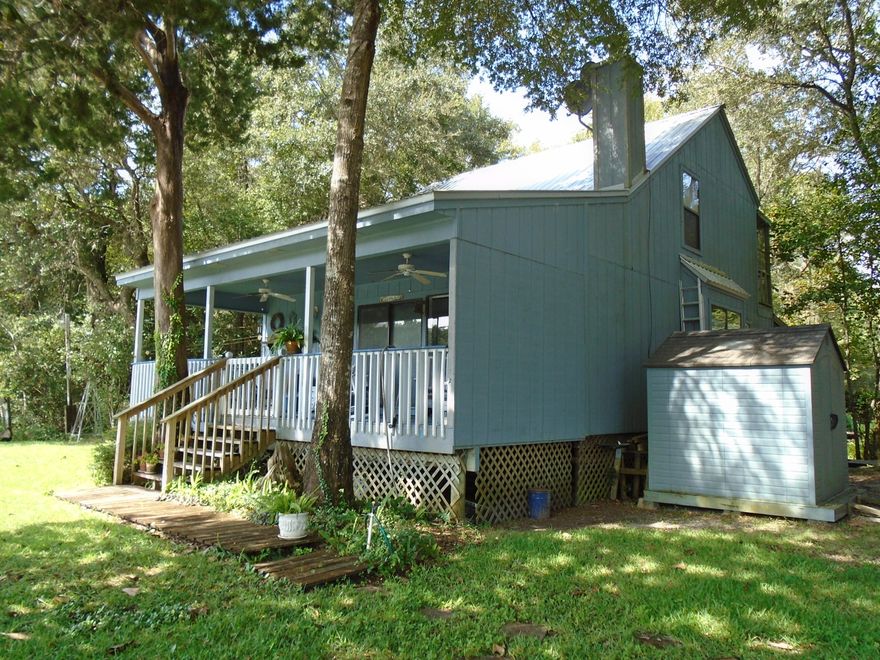 RIVERFRONT and fully furnished. Your spot on the river is ready for you. 3 bedroom, 2 bath home with a 10 x 28 porch (with ceiling fans) overlooking the Choctawhatchee River. Floating dock and stairway to the water make this a fisherman's paradise. Home features a gas fireplace, built in bookshelves, vaulted ceiling and open staircase. 2nd floor balcony plus front deck with beautifully landscaped lawn. Seller is leaving all the furnishings, dishes, washer/dryer plus lawn equipment. Home is just a quick 10 minute drive to Northwest Fl Beaches International Airport and a 20 minute drive to Panama City Beach.