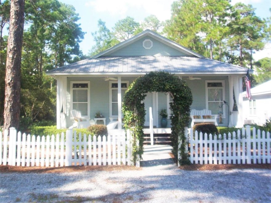 Charming Well Maintained Florida Cottage at end of quiet street surrounded by tall pine trees. Short walk to Community Boat Ramp on the Bay. Open Split Bedroom Floor Plan, 9' Ceilings. Large Front Porch, Screened Back Porch. Newer HVAC and Water Heater. Recently Connected to Sewer. Room For a Pool in the fenced back yard.