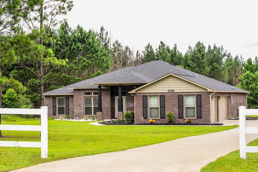 Major Price Reduction!! Exquisite 4 Bedroom 3 Bath home with 2680 SF and a 3 car garage situated on a private 1 acre lot with mature trees. This incredible home is complimented with 10 Foot Ceilings in the main living areas, Office with French Doors, Large Family Room, Custom Kitchen with Stainless Appliances and Tile Floors, Formal Dining Room with Hardwood Floors and French Doors, Large Additional Bedrooms and a 12x20 Covered Back Porch. This is a very open floor plan with lots of upgraded finishes. The Large Master Suite has Trey Ceilings and a Walk-In Closets. The Master Bath has Dual Vanities, Garden Tub and Separate Shower. This incredible home is within short walking distance to the Community Lake. This Home is a Must See!!