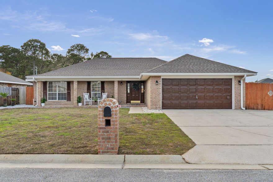 Location, Location, Location. Welcome home to the conveniently located Hampton Ridge Community! With only minutes to the sugar white sand beach, shopping, and amazing dining facilities, this home and its location leave very little to be desired. This charming split bedroom floor plan residence features 4 bedrooms, 2 bathrooms and is a true haven with a plethora of amenities that will make you feel like you're on a perpetual vacation. From the moment you park in the expansive driveway, you'll be captivated by the allure of this property.As you step through the door, you're greeted by a spacious living area featuring a stacked stone fireplace with TV mounted above, a stained shiplap feature wall and oversized tile flooring.  The great room seamlessly flows into the dining and kitchen area, providing an ideal space for entertainment.  The kitchen offers both style and functionality with great cabinet space, a pantry, stainless steel appliances and a decorative hanging pot rack.  All bedrooms have newly installed laminate vinyl plank flooring so there is no carpet to contend with.  The master suite is located off the dining/kitchen and overlooks the patio and pool and a walk-in closet, a double vanity, tiled shower, and enclosed water closet.   The 3 guest bedrooms are generous in size and share a guest bath.  The majority of the home has received a fresh coat of paint, including the garage and its epoxied floor, creating a clean and inviting atmosphere.

Beyond the great room lies a backyard oasis, your personal Shangri-la. Here, a breathtaking saltwater pool and hot tub await, surrounded by ample space for a barbecue area, fire pit, and more. The patio with a metal roof provides a shaded area to enjoy your outdoor living experience in all seasons.

But the amenities don't end there! This home also features an additional 2-car garage with an attached carport for all of your workshop and storage needs, while providing plenty of room for your boat and RV. It's the perfect setup for those who love to embark on adventures or simply enjoy outdoor activities. Don't miss the opportunity to make this stunning property your forever home.

Buyer is responsible for verifying all data and information including lot size and room measurements as it is deemed reliable but not guaranteed.