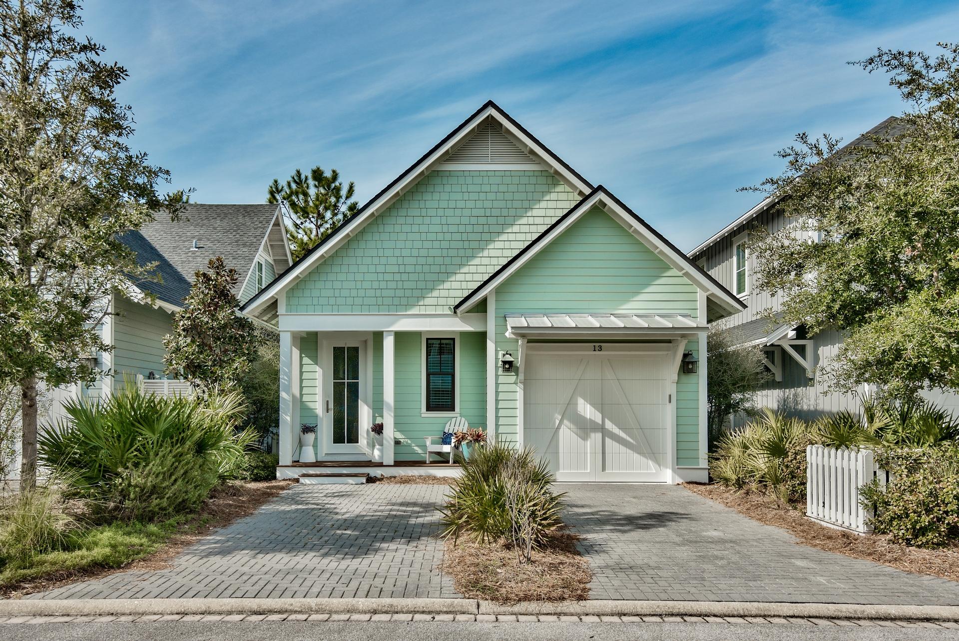 Welcome to your perfect 30a beach home! Located in the private gated community of Watersound West Beach, you will enjoy beach access to one of 30a's premier secluded beaches through Deer Lake State Park. This lovely cottage is the perfect family retreat with a spacious open great room, kitchen, and dining area that leads to a screened porch featuring a custom porch swing and outdoor dining. The master suite is conveniently located on the first floor as well as a powder room and laundry with front loading washer and dryer. Upstairs, there is a loft area which is a perfect kids retreat and doubles for a sleeping area with a daybed/trundle. Off the loft area are two more bedrooms--one with a king bed and one with a twin over full bunk bed. This beautiful home is being offered fully furnished and rental ready and features gorgeous hardwood floors, granite counters, stainless appliances, and custom touches throughout. There is also a single car garage! Watersound West Beach features a community pool/clubhouse, boardwalks, two parks, boardwalk to the beach, and fitness center at Watersound Beach. Enjoy the beach life!!!