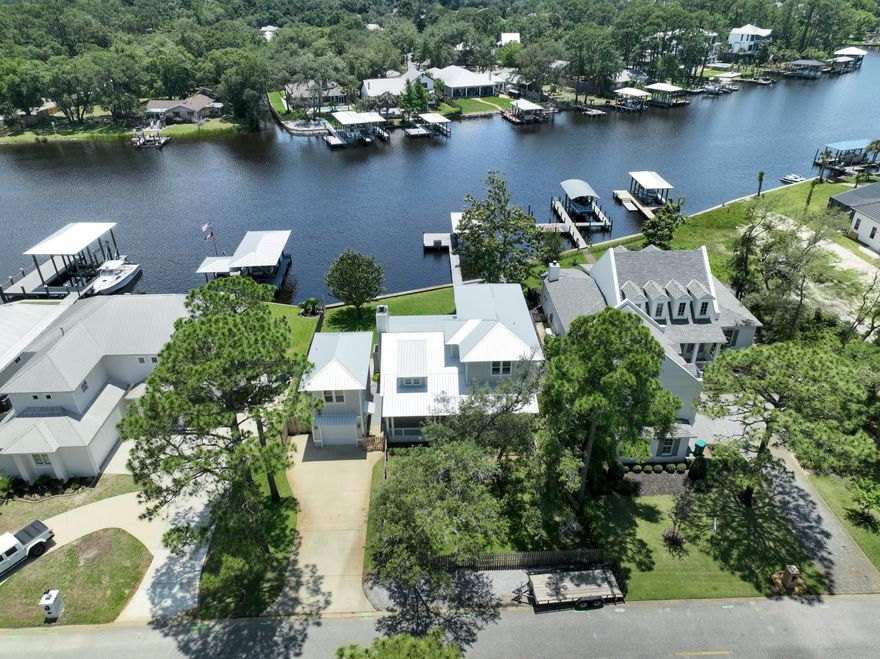 Searching for the quintessential waterfront lifestyle, with deep water, in Santa Rosa Beach? Look no further! This 2015 home was designed and built with the relaxing bayou lifestyle at its core. With two covered patios, full outdoor deck, fire-pit and large open dock, 192 Buck Road is perfect for relaxing and entertaining alike. No detail was spared for the pursuit of access to the Choctawhatchee Bay and Gulf of Mexico. This property boasts 80 waterfront feet on Buck Bayou, 55 foot long dock with 5 foot plus feed of water depth, 6000 lb covered boat lift, and is perfectly designed to enjoy life on the bayou! Of course the interior of the home is just as wonderful, as you'll see in the photos.