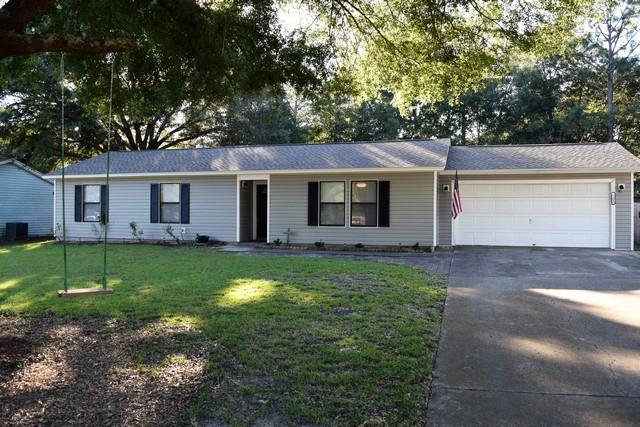 Welcome home to this charming 3 bedroom and 2 full bath home with over 1100 square feet. Located in North Crestview with lots of shade trees. Swing under the beautiful Oak tree in the front yard. Kitchen has stainless steel appliances with a beautiful mosaic backsplash. Kitchen comes equipped with stove, dishwasher, microwave, disposal and plenty of cabinets. Eat in kitchen has plenty of room for your dining room table and china cabinet. Hardwood laminate throughout kitchen, dining and living room. Enjoy your morning coffee on the screen porch. Large open living room. Both bathrooms are updated with nice vanities and tile surround tub in the hall bath. New carpet in 3rd BR. Large yard both front and back. New Roof in 2015 and new HVAC in 2012. Buyer to verify any info they deem important.