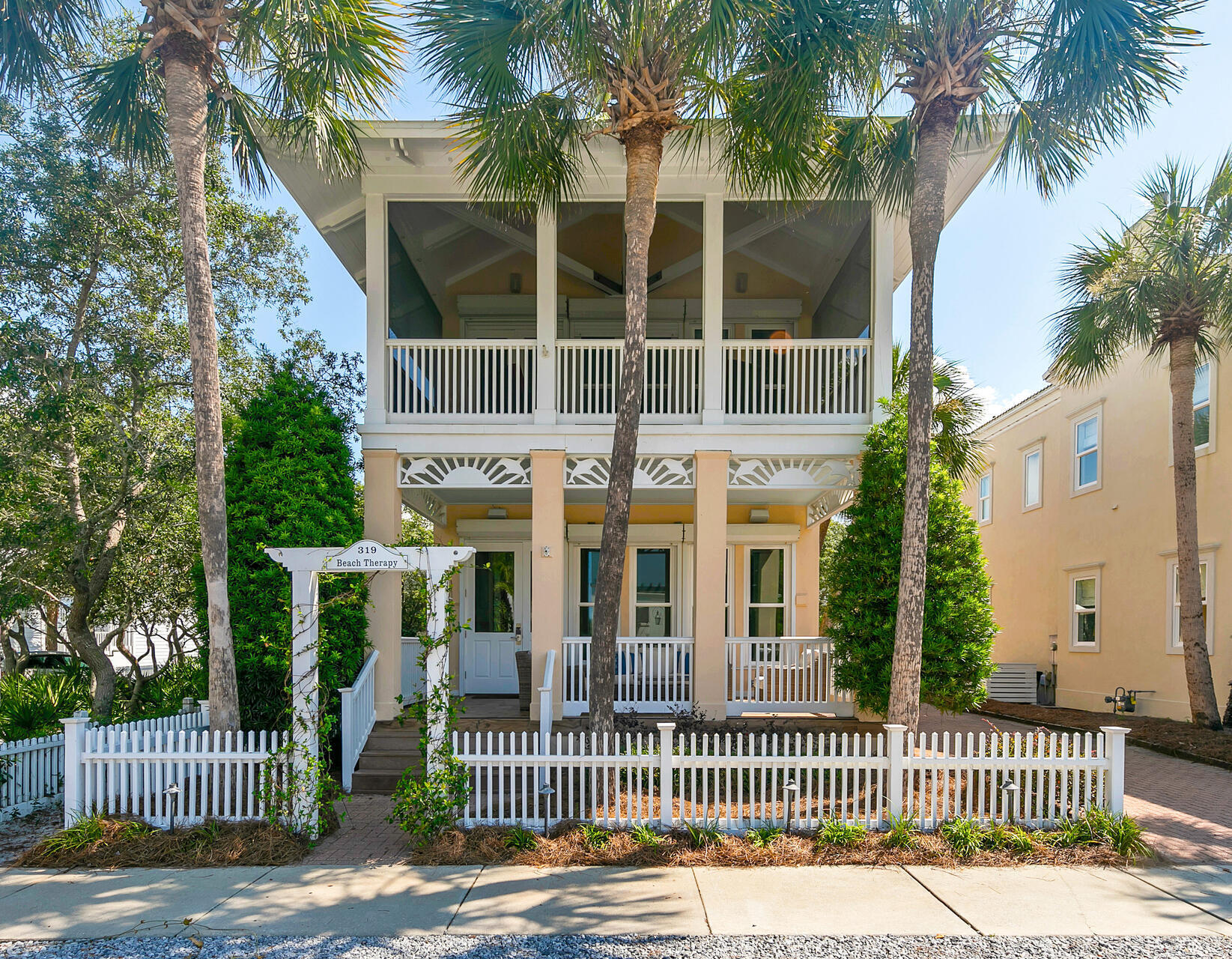 ''Beach Therapy'' is directly across from the beach walkover. Great Gulf Views from the third story tower and balconey overlooking the Gulf and the Carillon Community.The first floor offers a large sitting area with a gas fireplace, updated kitchen with eat in island for the kids. The first floor includes a bedroom and full bath. The second floor offers a bedroom with ensuite bath, hall bunks for the kids, and a very large master bedroom with updated bathroom and giant walk in closet. A screen room off the master is perfect for coffee in the morning. Additionally, a one car detached garage offers great storage posibilities. This house is immaculate and rental ready in a very desirable area of Carillon.