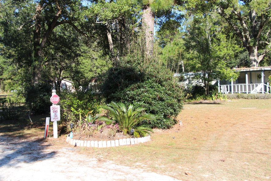 Easy access to the gulf beaches (about 10 minutes) and about 20 minutes to Destin. Older Mobile Home on property considered no value, property sold ''As Is'' See agents notes for restrictions. The property has city water, septic, and power pole. There is a shed and an additional covered storage (carport) on the property.  All information and dimensions to be verified by the buyer.
