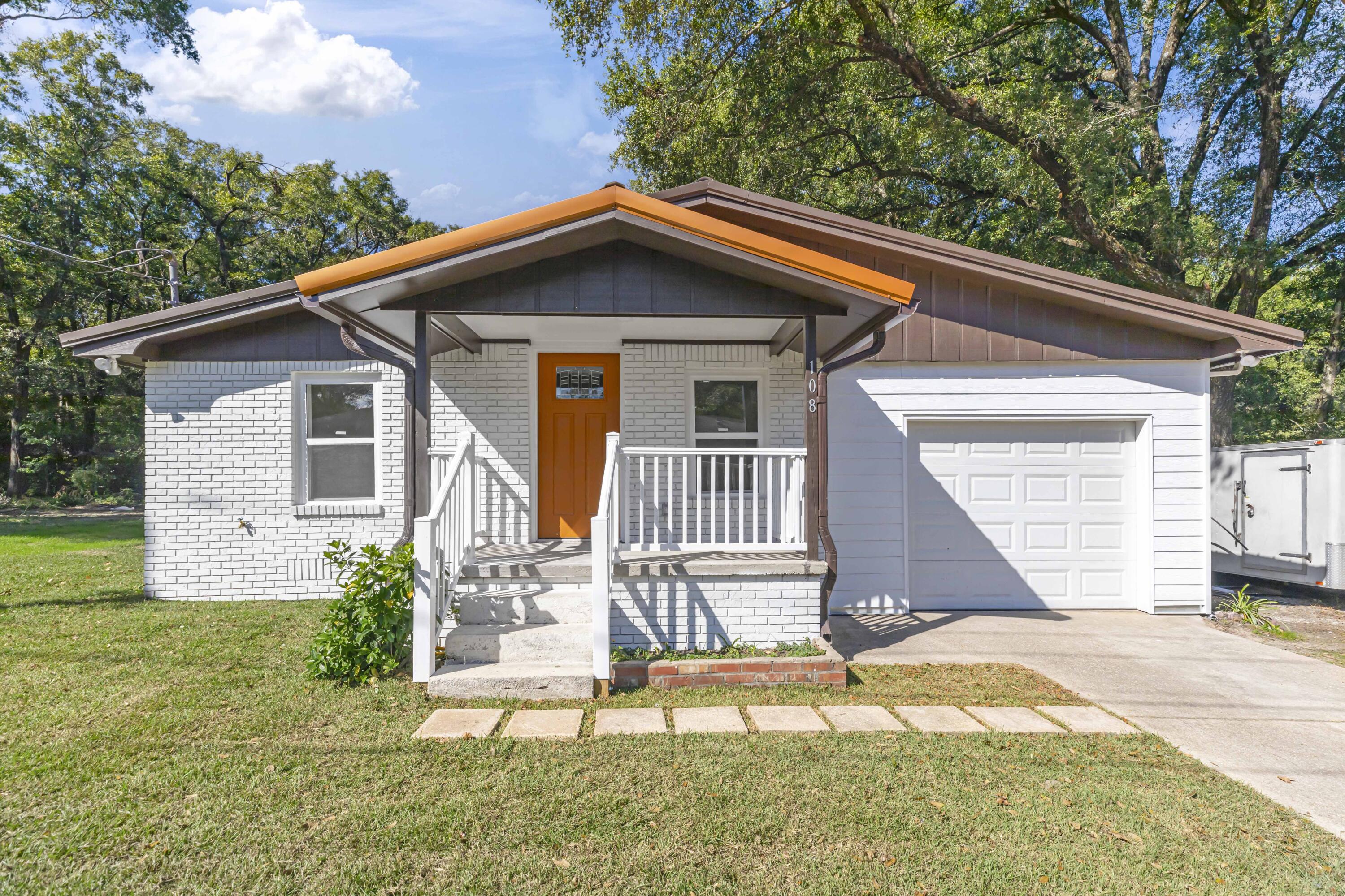 Effective build date has been updated due to extensive renovations. This like new home sits on a large flat beautiful lot with mature trees. With three bedrooms and two and a half bathrooms you will have lots of room to grow in this home. This kitchen is a chefs dream. There are new shaker style cabinets, and large counter height bar. No carpet in this home. All flooring is tile or vinyl plank. You will never want to leave this owner's suite. The bathroom is completely tiled, here is a double vanity and walk in tiled shower. The soaking tub sets by a large picture window. You wont feel cramped in this master closet. Add this home to your 'MUST SEE' list.