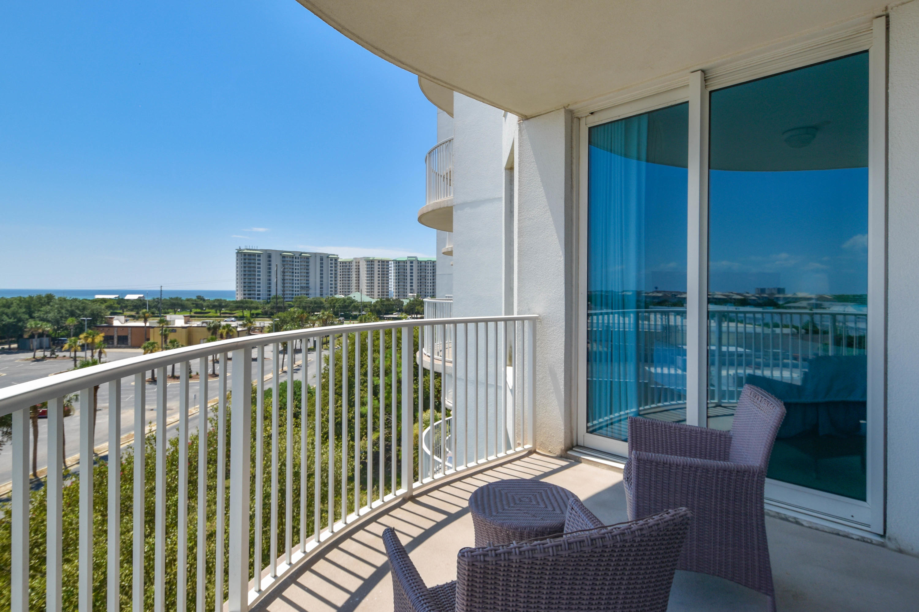 This two-bedroom 5th floor condo offers an open concept living and dining area, as well as a private balcony looking over Henderson Beach. The lagoon pool and water features are the resort's crowning attractions. Onsite amenities include multiple pools with waterfall features, a hot tub, playground, fitness center, and tennis and basketball courts. Also, newly added, is an on-site restaurant offering lunch, dinner, room service and even in-season poolside service. Shuttle service to the June White Decker Public Beach access is offered in-season. All utilities are included in HOA dues water, sewer, electric, cable, WiFi, phone, trash! Excellent opportunity for a vacation rental, second or primary home.