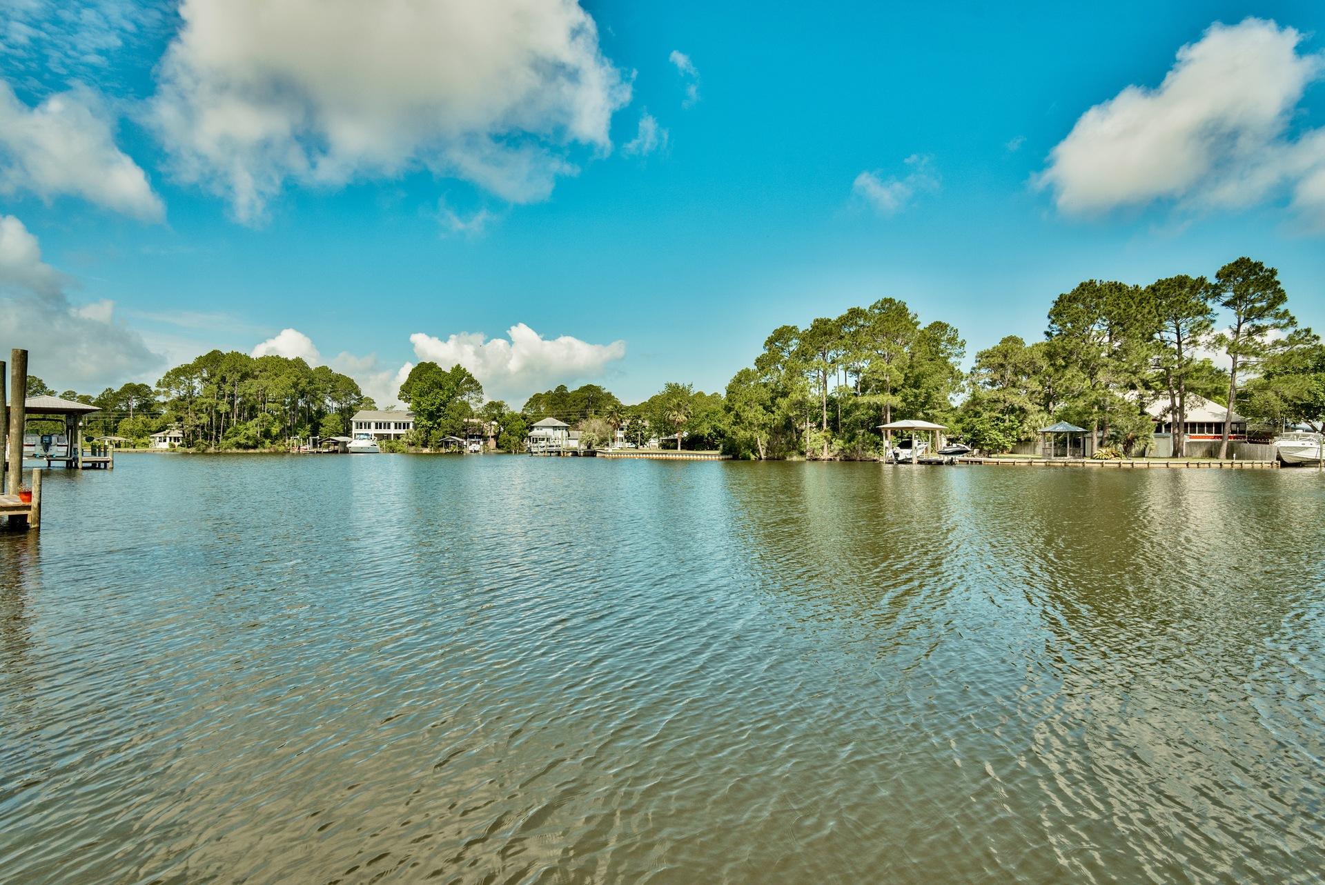A Boater's Paradise at an affordable price! Unit 3 is located in the Waterfront four-plex on Buck Bayou that leads directly to the bay. The unit comes with deeded boat slip with boat lift of 7,000 pounds and will fit up to a 24' boat. Recent updates include newly painted cabinets and interiors, a brand new smooth top cooktop, freshly painted/stained large back deck, recently painted exterior of building and new hardiboard siding. Each bedroom features an en suite bathroom. Excellent location ideally situated in between the Destin Harbor and Seaside and just about 3 miles from Sandestin Resort.