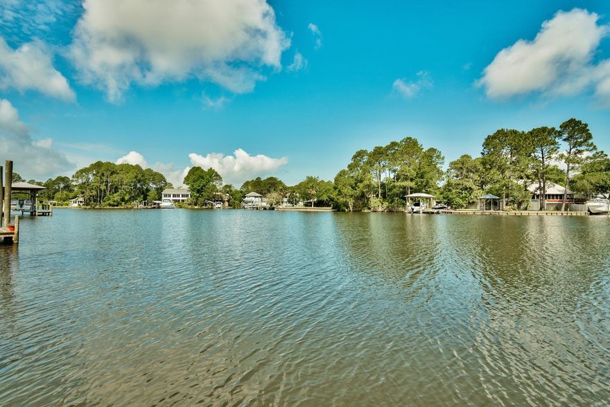 A Boater's Paradise at an affordable price! Unit 3 is located in the Waterfront four-plex on Buck Bayou that leads directly to the bay. The unit comes with deeded boat slip with boat lift of 7,000 pounds and will fit up to a 24' boat. Recent updates include newly painted cabinets and interiors, a brand new smooth top cooktop, freshly painted/stained large back deck, recently painted exterior of building and new hardiboard siding. Each bedroom features an en suite bathroom. Excellent location ideally situated in between the Destin Harbor and Seaside and just about 3 miles from Sandestin Resort.