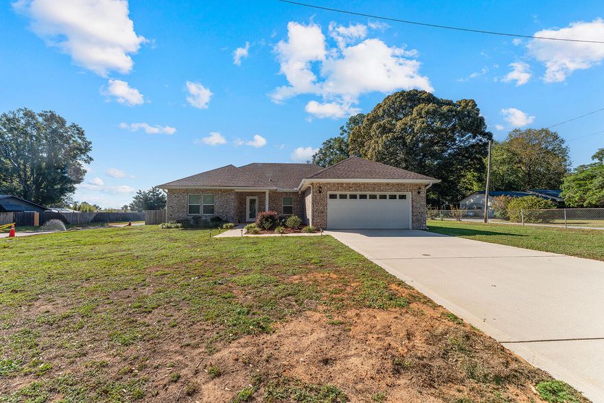 Welcome to 2944 Barton Rd--a beautifully custom-built all-brick home located on a desirable corner lot in the heart of Crestview. Built in 2022, this immaculate residence offers the perfect blend of style, comfort, and modern convenience.Step inside to discover 1,877 square feet of thoughtfully designed living space, featuring 3 spacious bedrooms, 2.5 baths, and elegant finishes throughout. The inviting living room boasts a lighted trey ceiling, creating an elevated ambiance perfect for relaxing or entertaining.The open-concept kitchen is a chef's dream, complete with quartz countertops, soft-close cabinetry, and stainless-steel appliances--still under warranty for one more year! A large laundry room with utility sink adds everyday convenience. while the 2-car garage offers plenty of storage.

The primary suite is a true retreat, showcasing a large walk-in closet, spacious vanity, walk-in shower, and separate water closet for added privacy.

Additional features include:
 * Fully fenced backyard with privacy fencing
 * Enclosed screened-in back porch - perfect for morning coffee or evening unwinding
 * Underground utilities for a cleaner aesthetic and added reliability
 * Irrigation system to keep your lawn lush year-round
 * Dimensional shingle roof for added curb appeal and durability
 * Transferable termite bond for peace of mind
 * Conveniently located just minutes from shopping, restaurants, banking, the post office, the public library, and the future Tax Collector's office, this home offers both comfort and accessibility.

Call your favorite Realtor to see this house today.