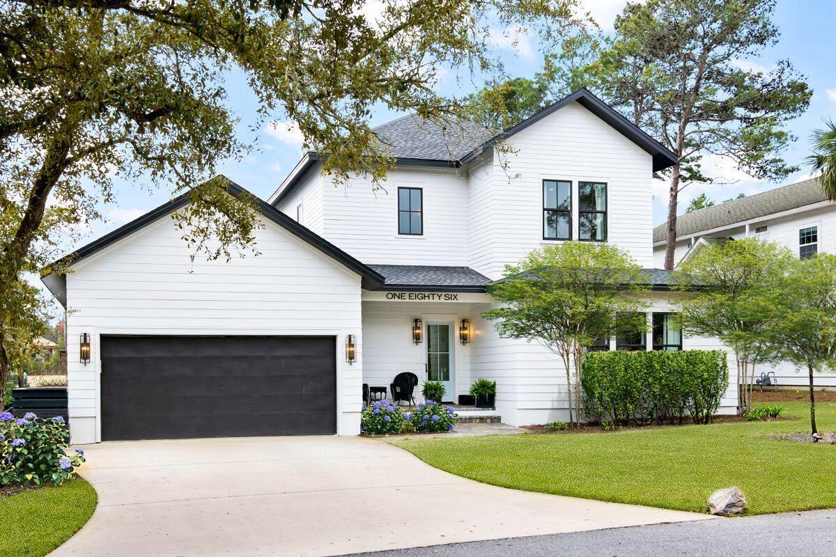 Completed in 2020, this contemporary custom home offers the complete package. Located on a quiet dead-end street, it has an impressive lawned front yard with double driveway leading to an air conditioned two-car garage. A neat covered porch provides a welcome place to relax for morning coffee. The glazed entrance door provides access to the welcoming foyer with cubby area and storage closets that blend into the shiplap, giving the home an admirable introduction. Move into the light, bright living/dining areas anchored by a cozy gas fireplace with a slate surround. It's a generous well-lit space with engineered hardwood floors for everyday living and entertaining.