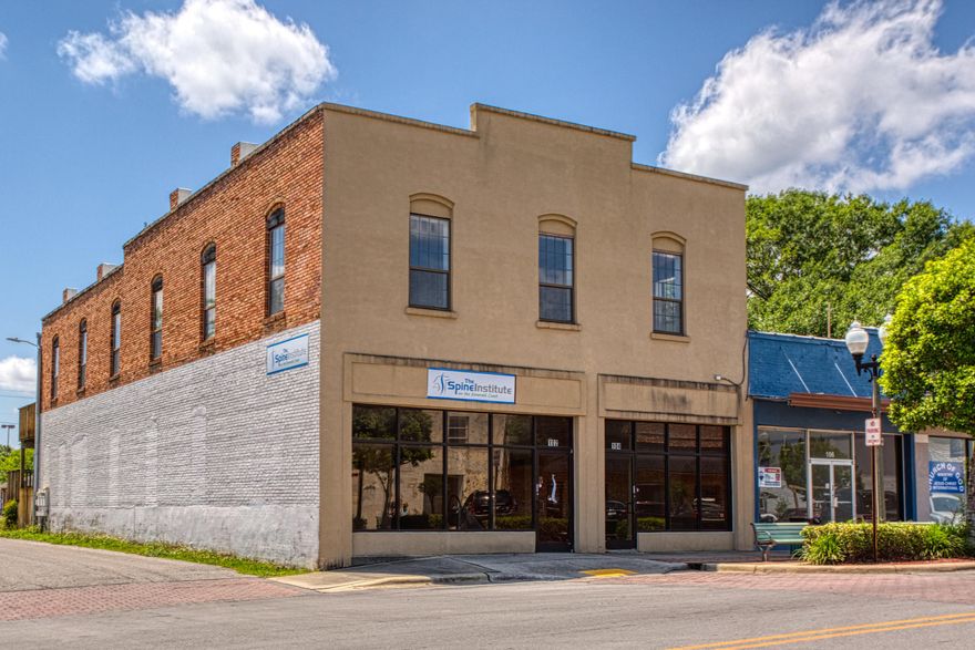 OWN A PIECE IF HISTORIC CRESTVIEW!FULL OF CHARM & URBAN APPEAL. This extraordinary 1925 double storefront, brick and stucco building offers an excellent blend of original, unique architecture & contemporary updates. Sun lit rooms offer high ceilings with wood detail, and exposed brick and mortar throughout. Unique two store, two floor layouts will accommodate a multitude of business venues. A window may be added on the south side to provide drive through services.