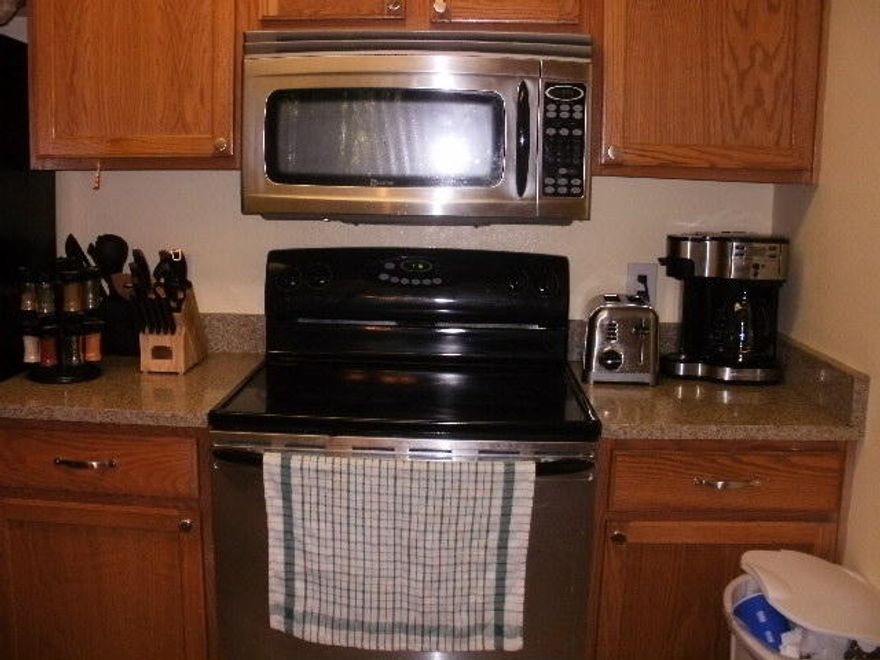 Ground floor unit with wood & tile flooring, Nice balcony with lot of privacy. (foot ceilings throughout unit. Granite counter tops and ungraded stainless steel appliances. Washer & dryer included. Unit has storage closet on balcony. Upgraded lighting in unit. Swimming pool & exercise room on site. Rental company on site.