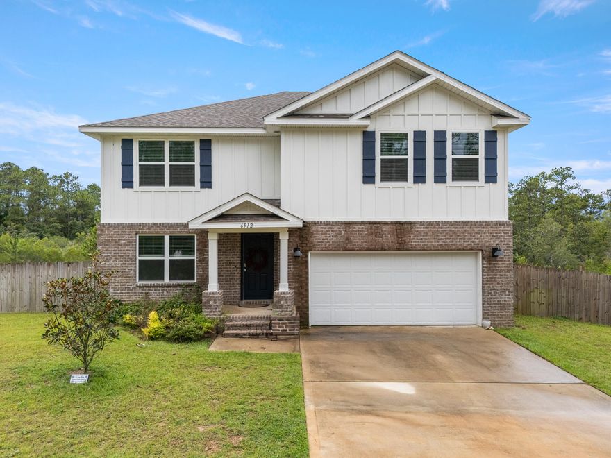 Picture yourself driving through a winding, tree-lined entrance into Heritage Plantation, a new neighborhood in quiet Laurel Hill where the hustle and bustle of Crestview feels pleasantly distant, yet minutes away. The sign at the entrance welcomes you home, hinting at a lifestyle rooted in nature and community. To your right, you glimpse a sparkling pool where neighbors are chatting and children are splashing--an easy place to make friends on a warm Saturday afternoon.As you pull up to your house on a larger-than-it-looks 0.38&#8209;acre lot, the mix of brick and Hardie Board on the exterior gives it a timeless look, while the backdrop of untouched greenbelt behind ensures there will always be trees framing your view. You step through the front door and into a cozy den where built-in shelves and cabinets flank an electric fireplace wrapped in stone; it's easy to imagine curling up with a book here or hanging family photos on those shelves. The den flows into a light-filled living room, dining area and kitchen, where stainless-steel appliances gleam and a center island invites breakfasts, homework sessions, and casual conversations.

On the main floor there's a private bedroom with a full bathperfect for visiting parents or grown children who need their own space. Upstairs, you discover a huge loft that might become a media room, a kids' playroom, or perhaps a second family lounge. Four bedrooms wait beyond, including an expansive primary suite with two walk-in closets, a double vanity and a walk-in shower that feels like a spa after a long day. With 2,406 square feet, five bedrooms, and three full baths, there's room to grow, room to entertain, and plenty of places to call your own.

In Heritage Plantation, mornings begin with birdsong and end under starlit skies, yet everything you needschools, shops, restaurantsis a short drive away. It's a setting that lets you live a quiet storybook life without sacrificing modern conveniences.