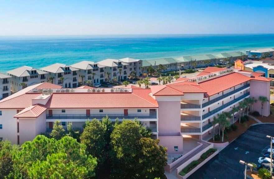 Enjoy this Emerald Waters GROUND FLOOR, fully furnished, 2 BR 2BTH extra spacious condominium just steps away from the sugar white sands of the Miramar Emerald Gulf Coast. Situated on Scenic Gulf Dr. across is your Deeded Beach Access yards from your covered patio overlooking the pool, gazebo, manicured lawns and palm trees. Parking is conveniently located a few feet from the front door for easy coming and going. Tasteful beach decor includes new wood tile flooring, furnishings, color schemes and artwork.  Large bathrooms includes garden tub, double vanity and plenty of counter space.  Several restaraunts, stores, shops and beaches are just a short walk or bikeride away. Turnkey and rental ready!! Owner's closet contents are reserved.