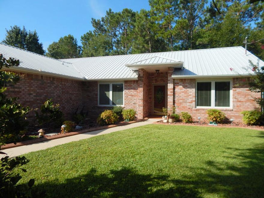 This 4 bedroom home is in PRISTINE condition, loaded with high end upgrades and turn key ready! As the first and only homeowners, they have prepared this home for the next fortunate owner. Inside you will enjoy the custom Pella triple pane windows throughout with built in blinds. The kitchen comes with quartz countertops, stainless steel appliances, a pantry, tiled floors and even the TV is staying with the home. There are tiled and wood floors throughout, a corner wood burning fireplace, overhead plant shelves, high end storm doors, sliding patio door and entry door. There is a high efficiency, 14 seer HVAC system. It is wired for surround sound, and has a vaulted ceiling in the great room. The bathrooms are very nice as well. The guest bathroom has a tiled shower/tub area.