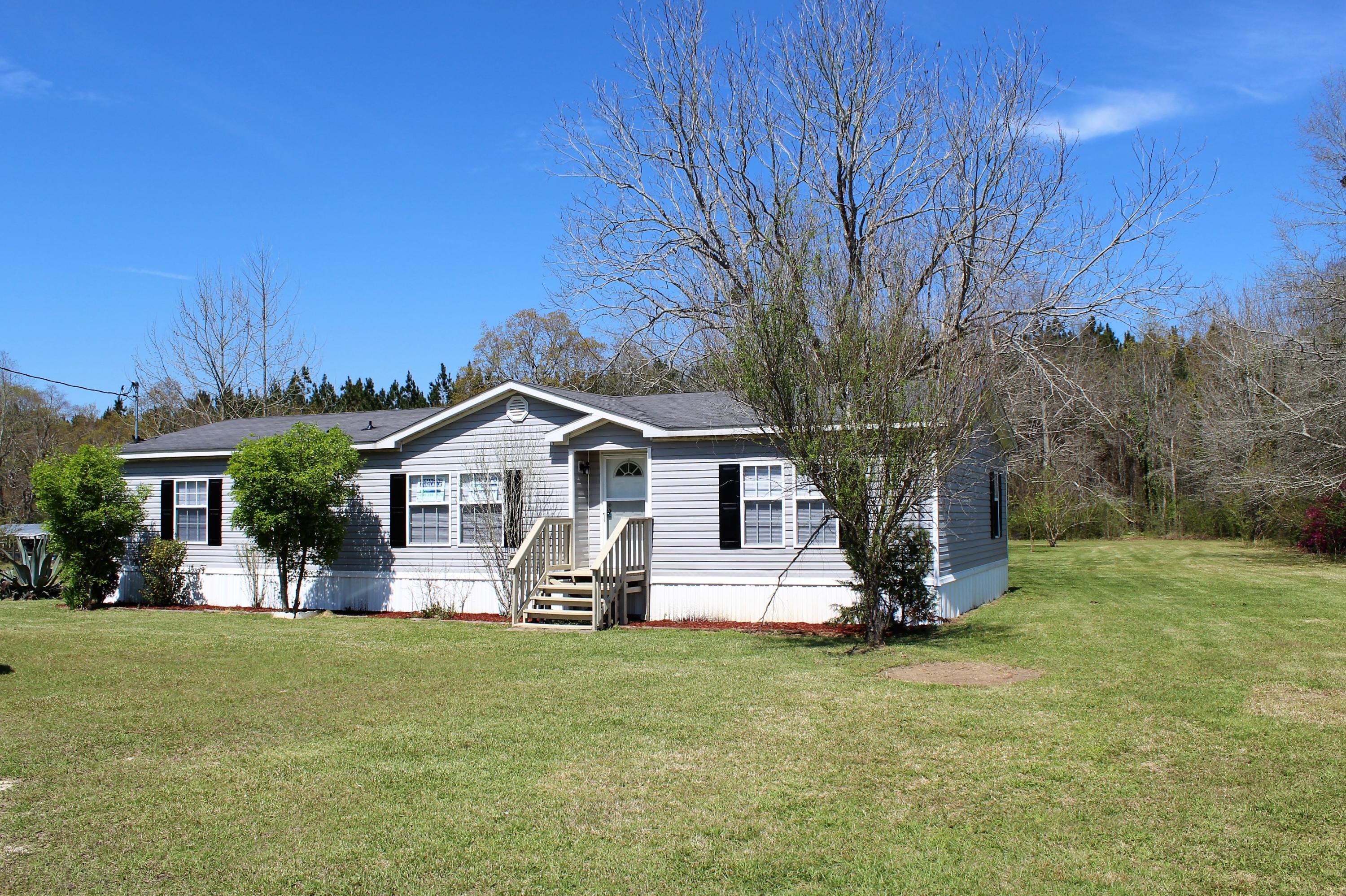 *SELLER FINANCING AVAILABLE TO MOST BUYERS* Like brand new! This fantastic home has all new carpet & fresh paint. The master suite has a huge walk-in closet with double bowl sinks, garden tub, and separate shower in the master bath. The large, covered deck overlooks the fully grassed back yard with 3 yard buildings and a greenhouse. Rural Mixed Use Zoned. *All measurements approximate