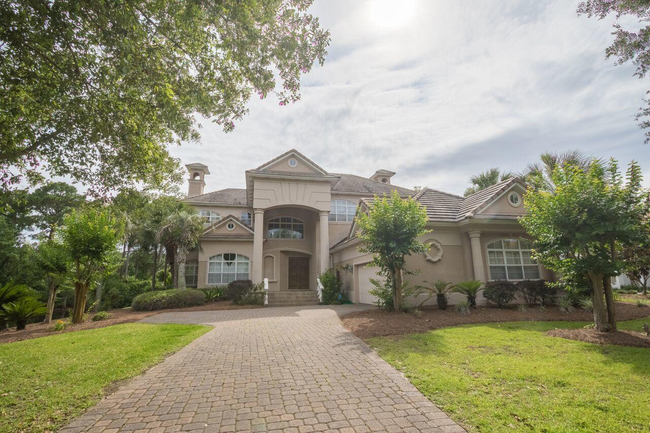 Recently appraised at $ 950,000. Listing at $ 875,000.Just reduced to $ 650,000. You must see to appreciate this gorgeous St Bart 11 signature home in the gated community of Regatta Bay. This large two story home offers a beautiful view from every window including the 16th fairway and the lake which wraps around the back and side of the home.The formal living room,dining room,office,den,kitchen,laundry room,additional bath and master bedroom suite are on the first level.3 additional bedrooms,two full baths,den and wet bar on the second floor.
