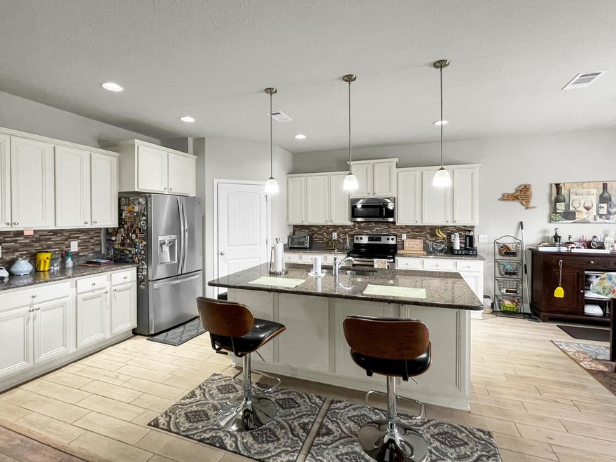 Your amazing perfect home is here! The Victoria is a 4 bedroom, 2 1/2 bath open concept with split bedroom plan. Master suite with garden tub, separate shower, double vanity and a huge walk in closet. Kitchen with large granite kitchen island, pantry and very large dining area. Additional bedrooms with 2nd full bath also with double vanity sinks. Separate laundry room, 1/2 bath for guests and a 19 foot covered patio. Major upgrades include protective permanent real hurricane shutters that easy your mind, simple to use and save you insurance costs! Energy saving and money saving solar panels all fully paid. Additional power fan to keep the house comfortable. Many more upgrades you need to book your appointment today. Tesla charger to be removed.