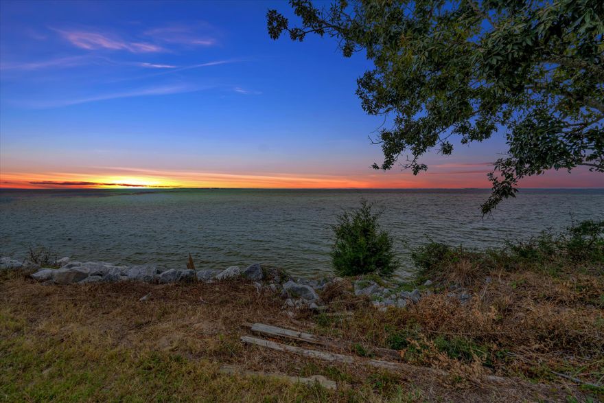 Enjoy the waterviews from this DEEDED bayfront home in Choctaw Beach! Built in 2020 on .51 acres, this spacious home features 2305sf with all the bells and whistles: leather granite in the kitchen, ample soft-close gray cabinets, upgraded Samsung Black stainless steel appliances, LVP flooring throughout. Open concept living with split 3 bedrooms plus office behind double french doors AND a bonus room also behind double french doors. All the advantages of a new build, with lower insurance, hurricane impact windows, Trex decking, 2 upgraded attic storage areas, full house ethernet plus built-in security system.  Oversized garage is on the back of the home along with a fenced backyard. Bayfront parcel to boat from, never use a trailer or pay to store your