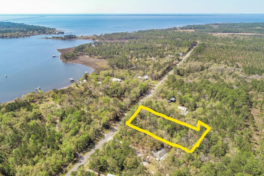 LOOKING FOR ACREAGE NEAR THE BAY TO BUILD YOUR DREAM HOME? You've found it. Beautiful, affordable, 3.1 Acre estate sized lot across the street from the Bay & just 1/2 mile from the Marina! Enjoy privacy and gorgeous natural setting but yet be close to shopping, schools and the water. With the Marina just 1/2 mile away, you can be on the water boating, swimming & enjoying the boating lifestyle within minutes. Although the majority of the acreage is located in flood zone X, so flood insurance should not be required when building your new home, Buyer to perform their own due diligence. NO HOA fees and NO build out time add to the appeal of this incredible acreage. Act now, as this opportunity won't last long.