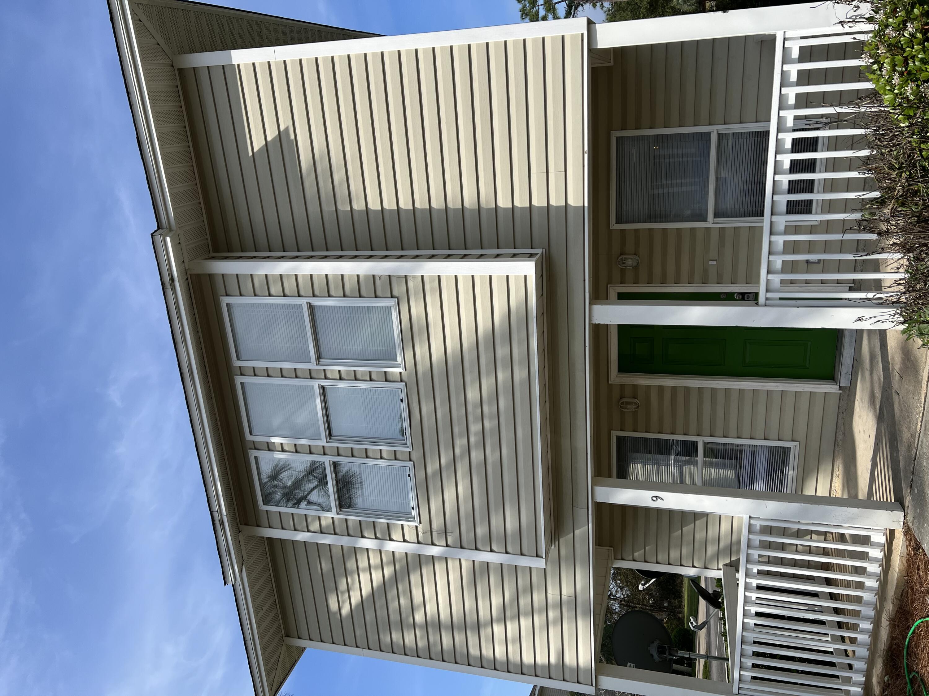 This 2 story Florida Cottage is located off of Mack Bayou road in Enchanted Estates and has a large living room and open galley style kitchen with breakfast bar. The Master Suite with walk in closet and double vanity is situated on the first floor and nicely separated from the main living area at the back of the home. The large second and third bedrooms as well as the second full bath and laundry room are on the second floor. There is a lovely covered porch off the main entrance from which to enjoy quiet evenings. This nicely maintained subdivision has a community pool and landscaped common areas. It is just minutes from the beaches, shops and activities that Destin and Santa Rosa Beach are famous for.