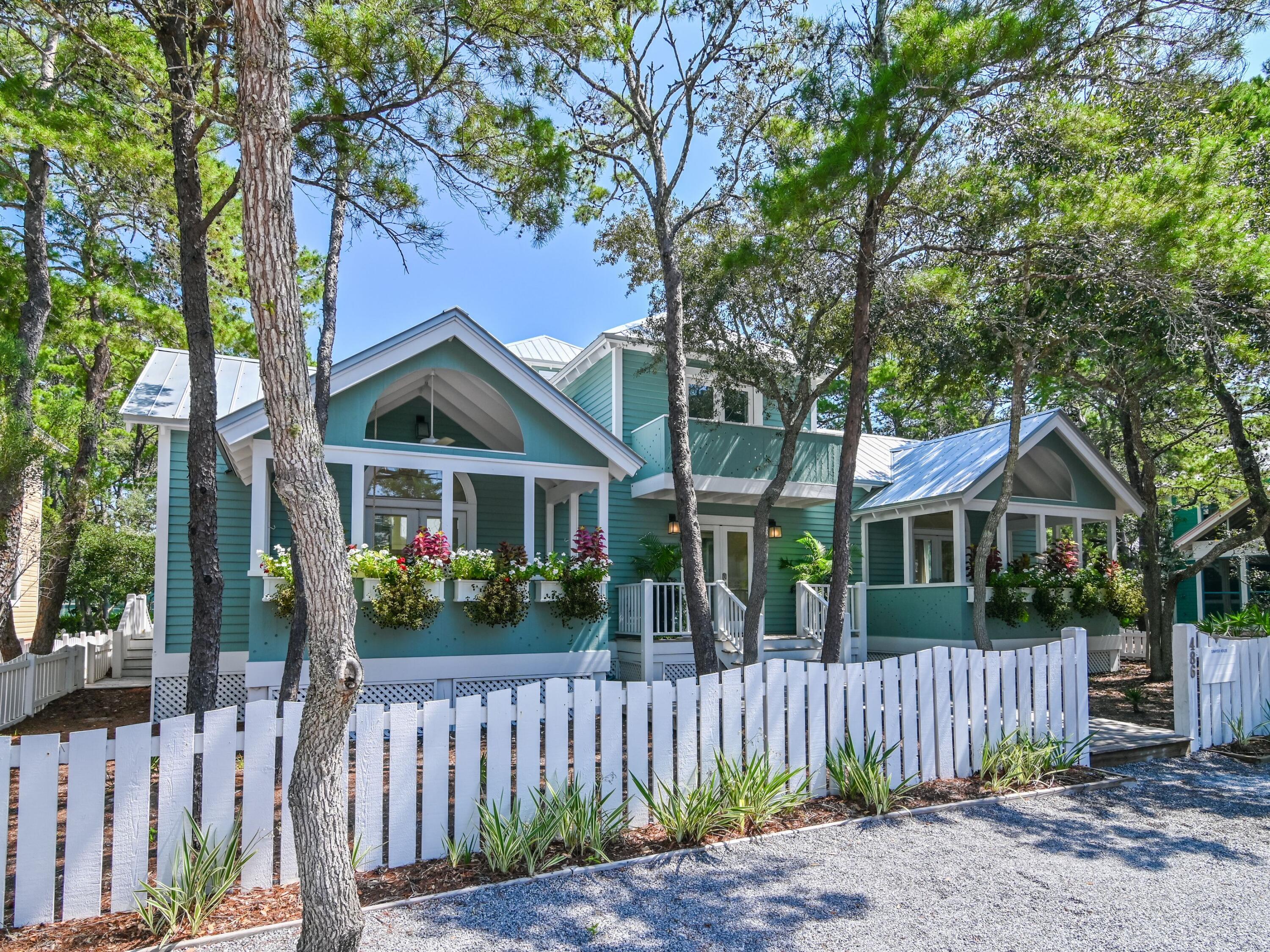 Seaside Perfection - Fully Refreshed Coastal Cottage Just Steps from the Town SquareThis beautifully reimagined 3-bedroom, 3.5-bath home in the heart of Seaside offers 2,294 square feet of light-filled living space and timeless architectural appeal by Scott Merrill. Recently refreshed inside and out, the home blends classic charm with modern comfort, featuring soaring ceilings, white oak floors, custom millwork, and designer lighting throughout.The open-concept living and dining area flows seamlessly into a bright, fully updated kitchen, while each spacious bedroom includes an en suite bath for privacy and ease. A new optional bunk room adds flexibility for guests or family. Multiple covered porches and a private courtyard extend the living experience outdoors, perfect for relaxing or entertaining.  The tower cottage offers living, kitchenette and a bed and bath along with a first level room that can be used for additional sleeping with a 1/2 bath.

Positioned just steps from Seaside's iconic town center, beach access, and green spaces, this home is offered refreshed awaiting your furnishing touches. A rare opportunity to own a refreshed original in one of 30A's most beloved communities.